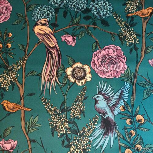 teal fabric with birds and flowers